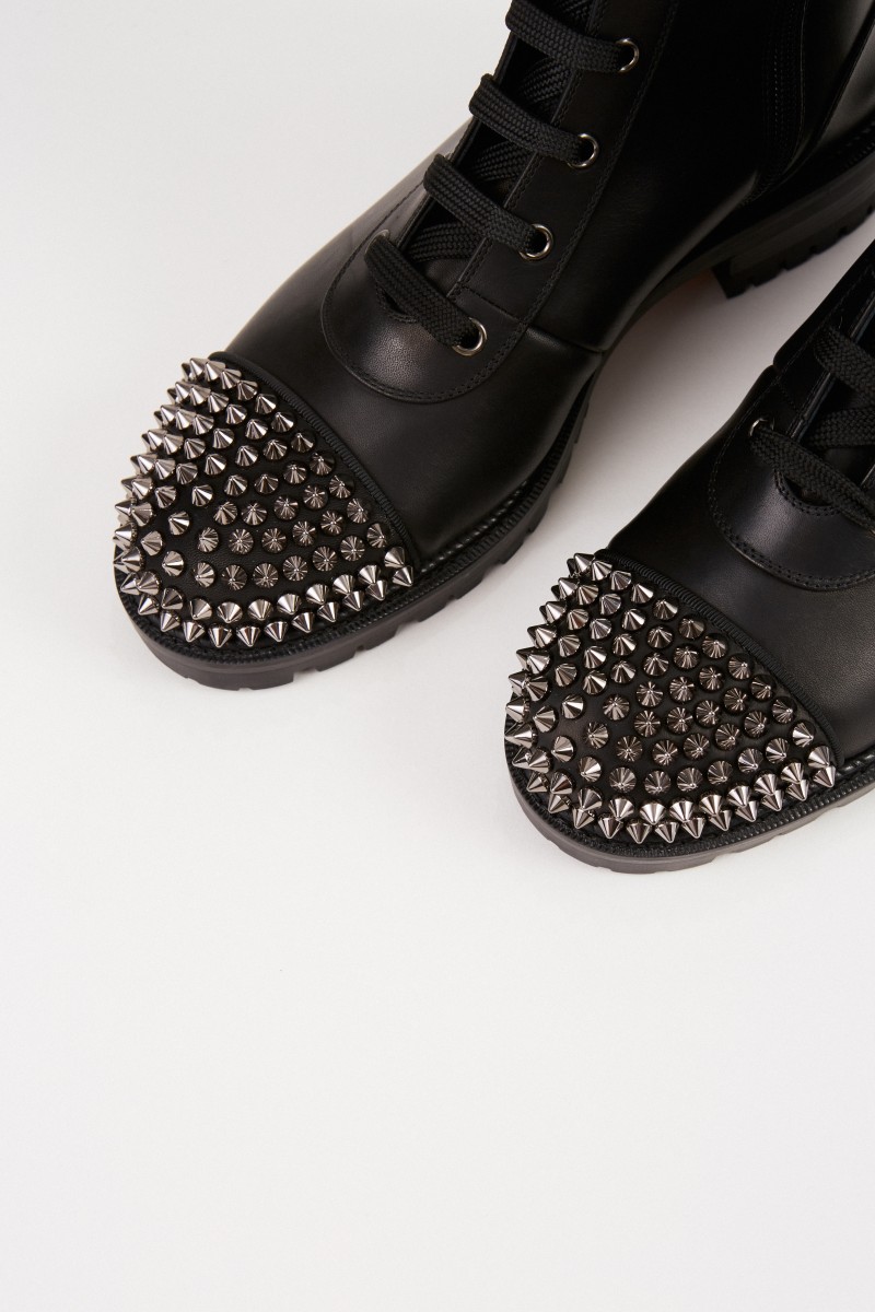 Christian Louboutin Leder-Boots mit Nietenkappe Schwarz